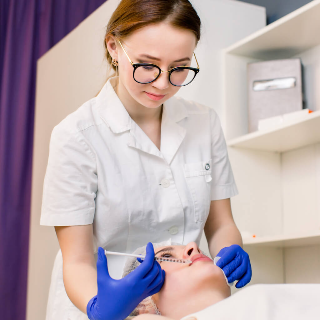 Clinician performing an injectable facial treatment